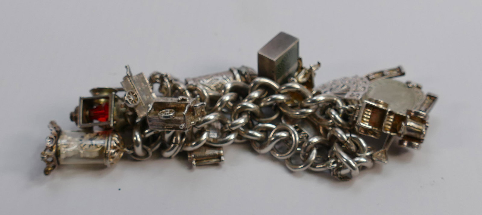 Good quality Silver charm bracelet with 13 charms,: Good quality Silver charm bracelet with 13 charms, 83.7g: