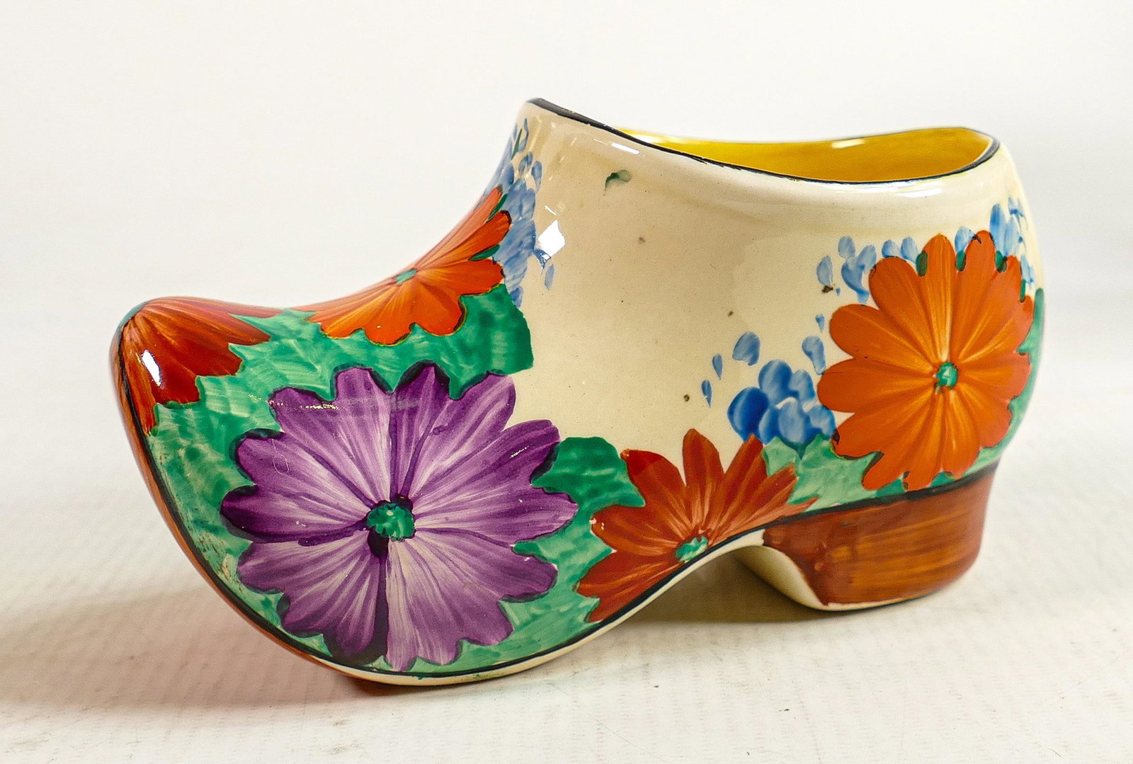 Clarice Cliff Newport Pottery clog decorated in the Gayday design: L15 x h.7.5cm.: Clarice Cliff Newport Pottery clog decorated in the Gayday design: L15 x h.7.5cm.