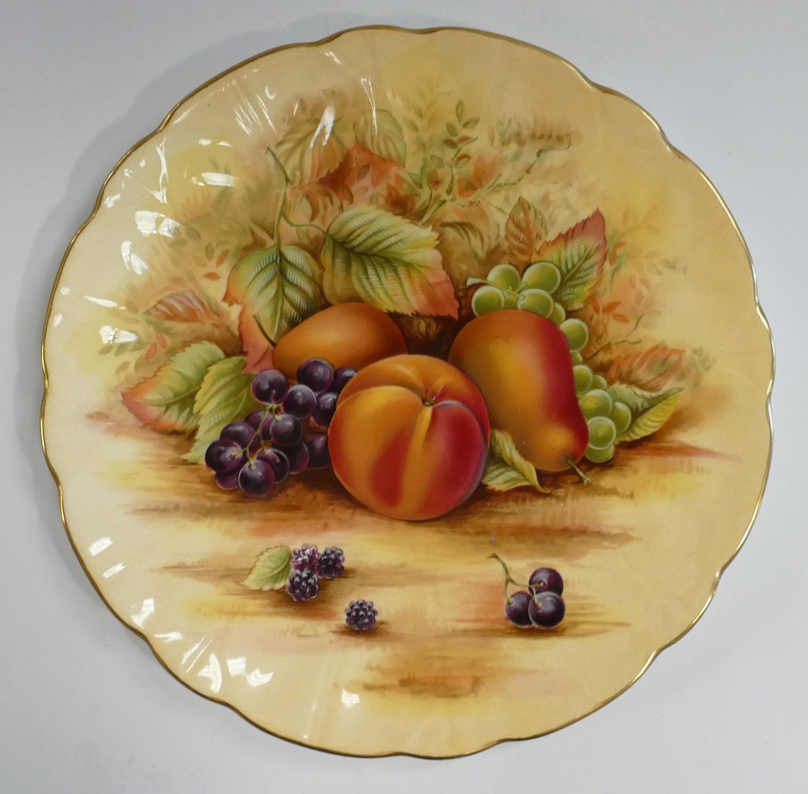 A collection of Aynsley Orchard Gold patterned items to include: Small vases, candle holders, rack (1 of 2)