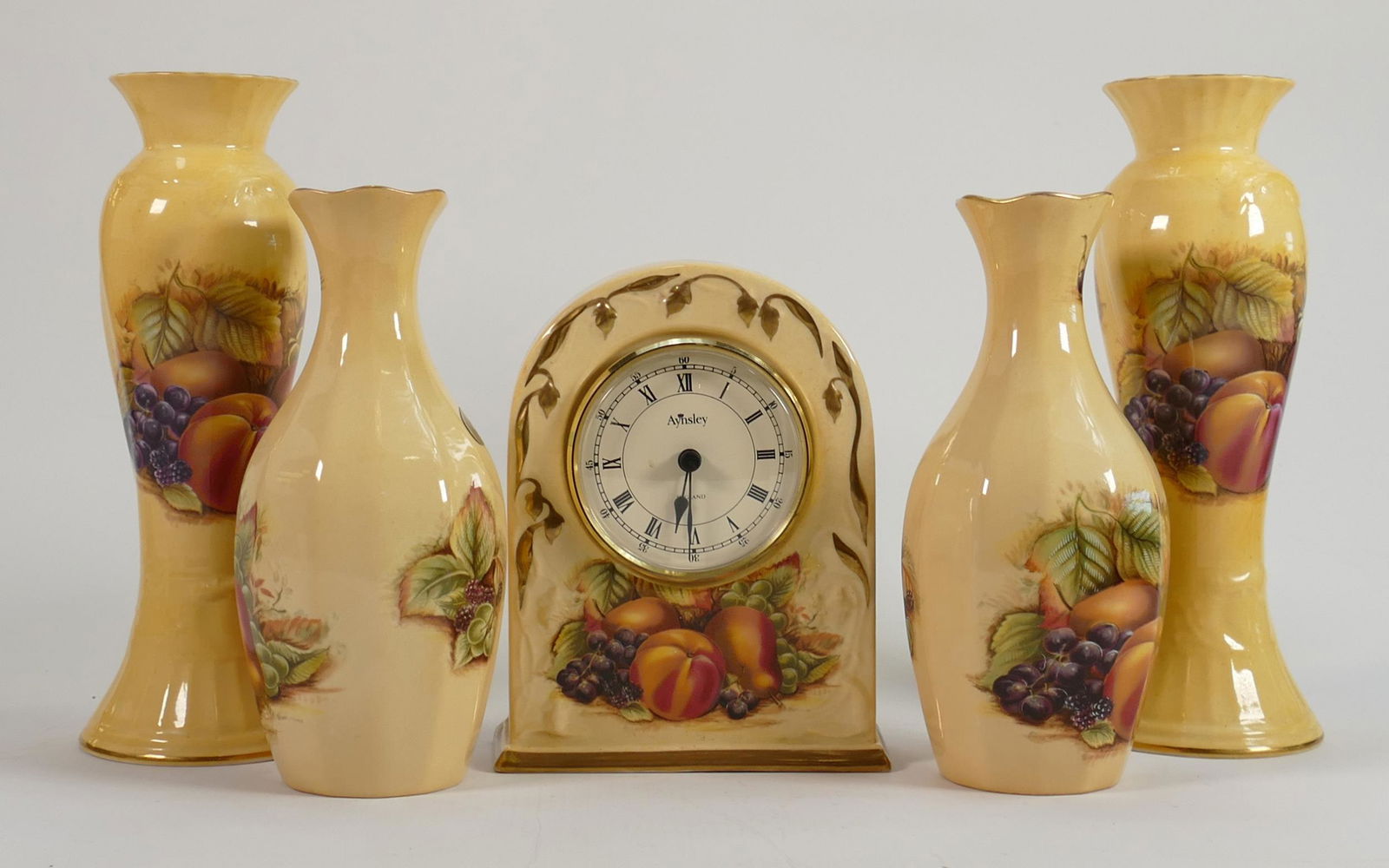A collection of Aynsley Orchard Gold patterned items to include: Vases & Mantle clock, height of (1 of 1)
