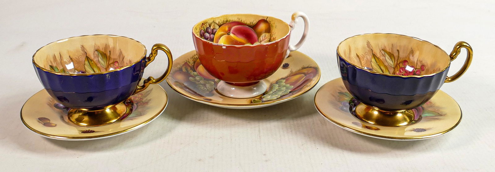 Aynsley Orchard Gold patterned cups & saucers: One non matching cup & saucer set noted (1 of 3)