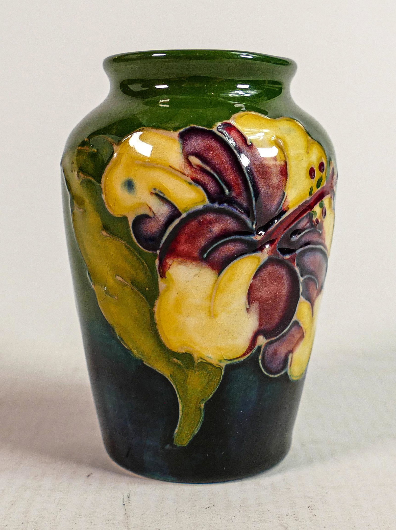 Moorcroft Hibiscus on faded green ground vase: Height 9cm (1 of 3)