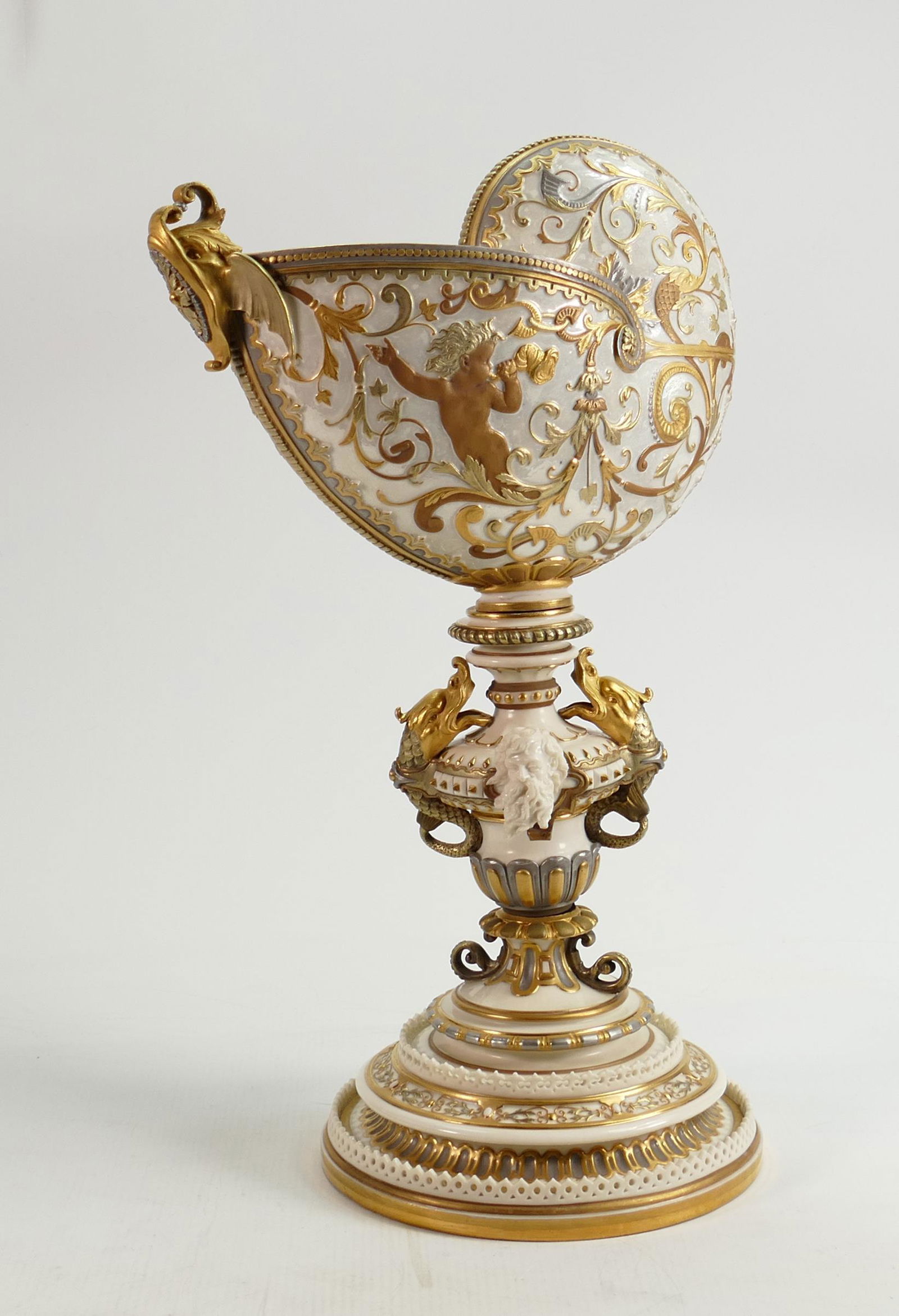 19th century Royal Worcester gilded pearlescent shell vase on pedestal: Formed as a nautilus shell: 19th century Royal Worcester gilded pearlescent shell vase on pedestal: Formed as a nautilus shell decorated with putti and the column decorated with sea creatures and mermen, modelled by James Hadley
