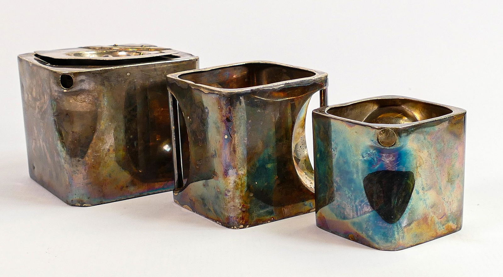 Robert Johnson patent silver plated "The Cube" tea set: By Napper & Davenport, Birmingham, England,: Robert Johnson patent silver plated "The Cube" tea set: By Napper & Davenport, Birmingham, England, comprising teapot, sugar and cream jug, height of teapot 8cm. (3)