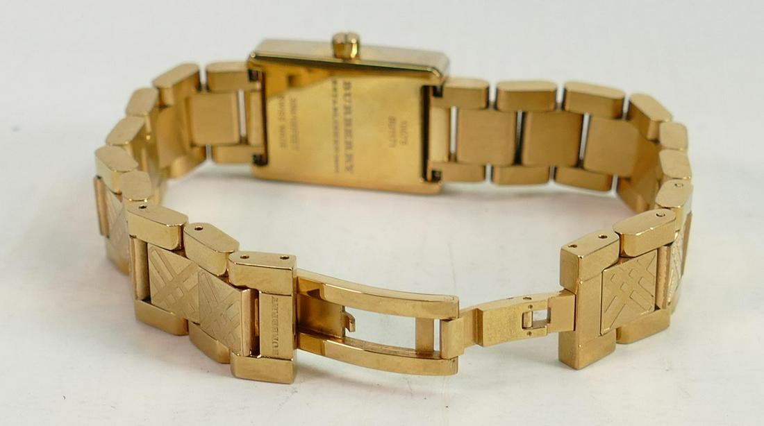 Burberry ladies gold plated wristwatch: Together with warranty card, paperwork and boxed. (1 of 2)