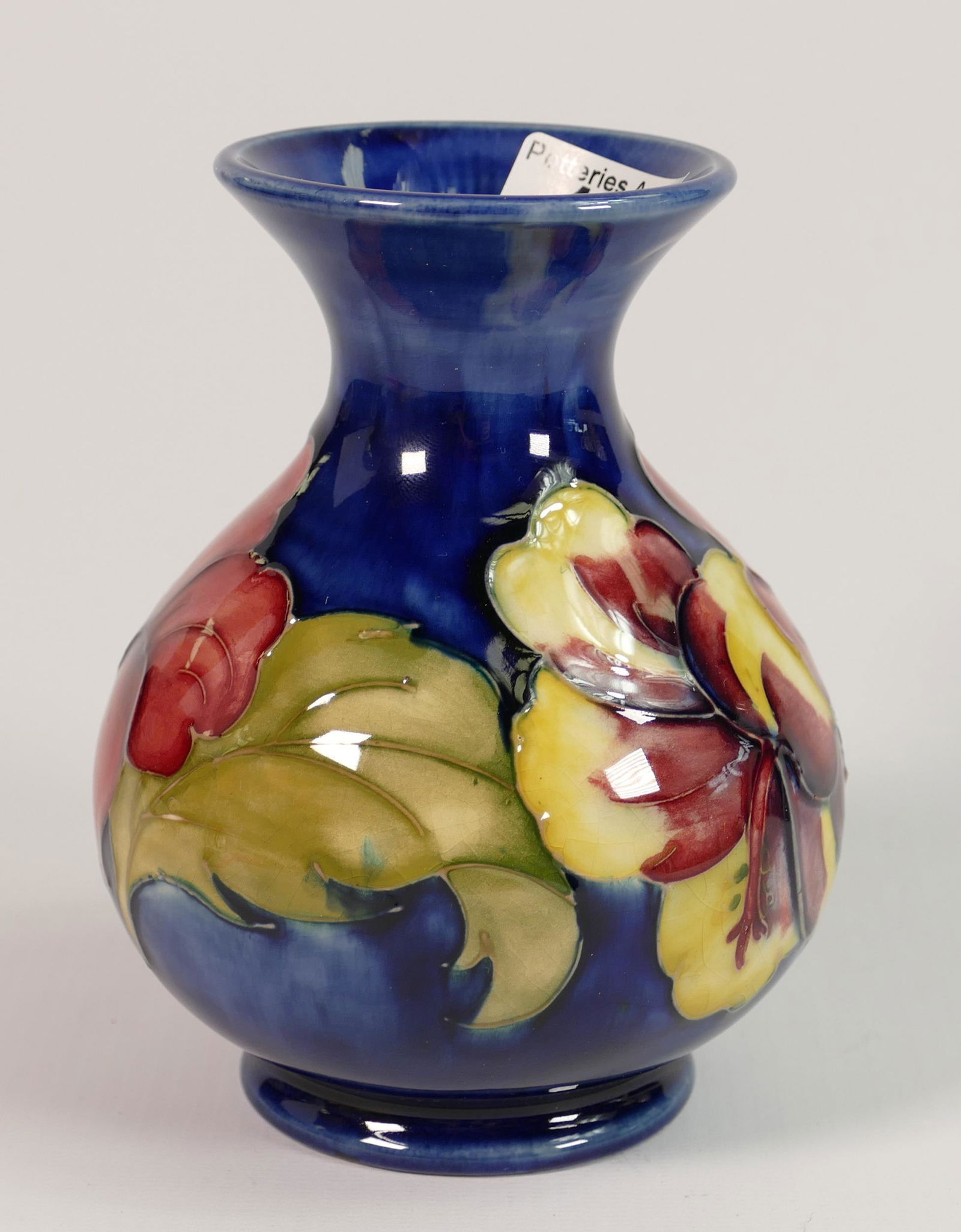 Moorcroft Hibiscus on Blue Ground Vase: Queen Mary Label noted, height 13cm (1 of 1)