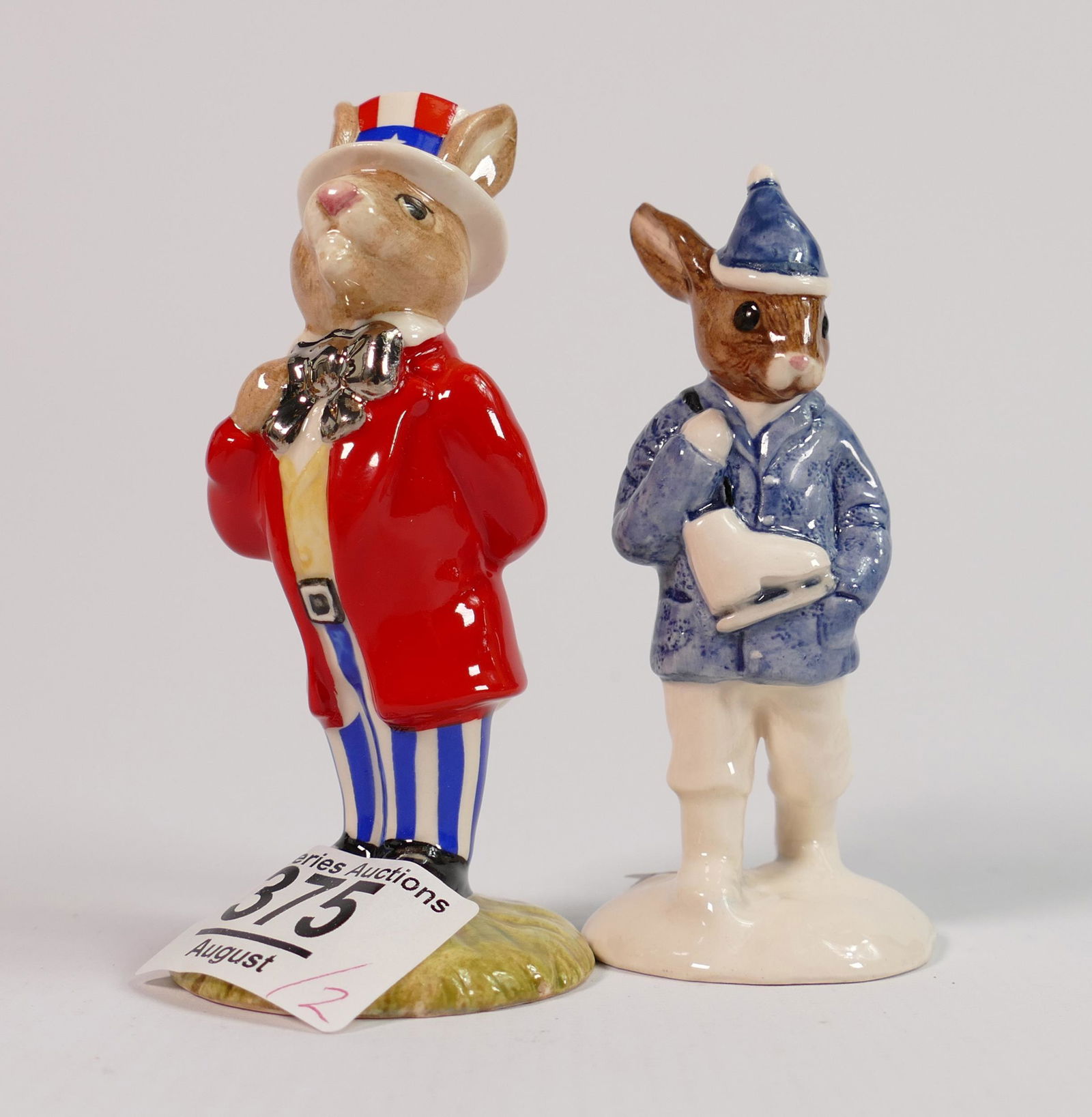 Royal Doulton Bunnykins figures Uncle Sam DB175 and Boy skater in unusual white & blue colourway. (1 of 1)
