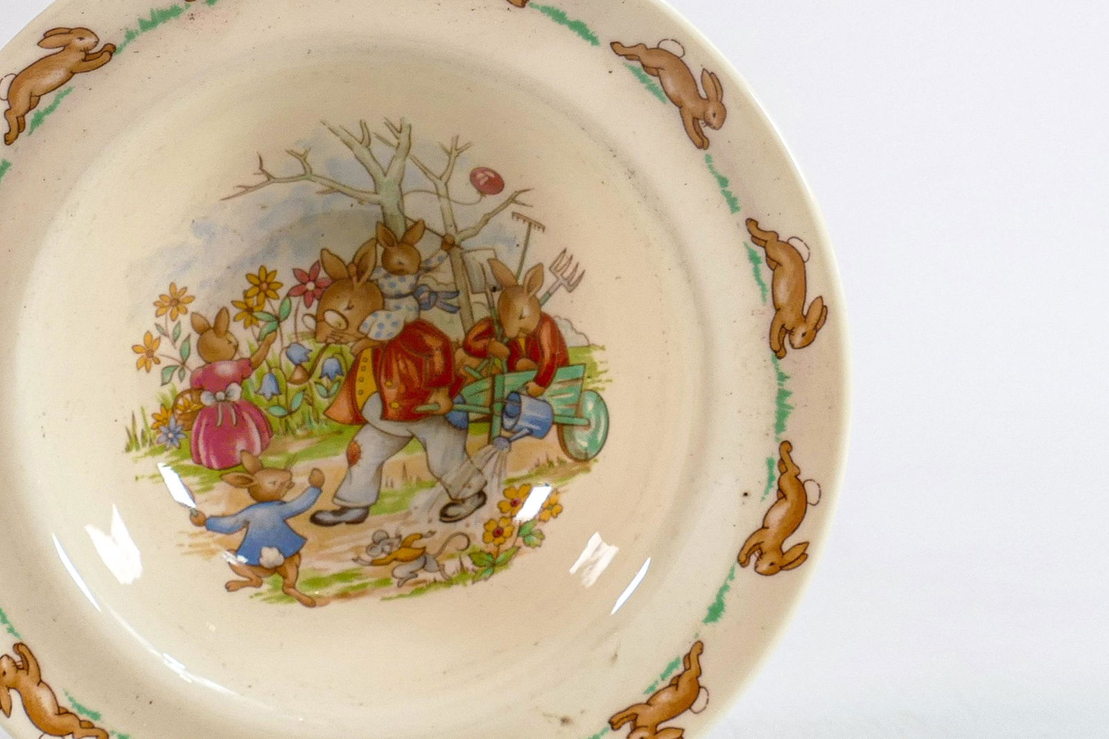 Royal Doulton Bunnykins items to include - cups and saucers, loose cups, egg cups, bowls, money: Royal Doulton Bunnykins items to include - cups and saucers, loose cups, egg cups, bowls, money boxes & two tier cake stand.