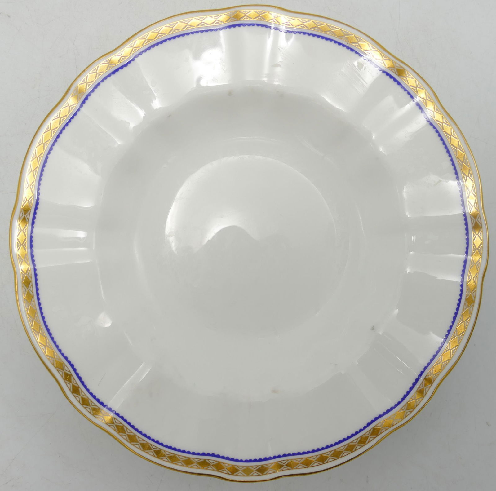 A large collection of Royal Crown Derby Carlton Blue patterned tea & dinner ware to include - tea: A large collection of Royal Crown Derby Carlton Blue patterned tea & dinner ware to include - tea set, dinner plates, rimmed bowls, sauce boats etc. lightly used with some plates showing knife marks.