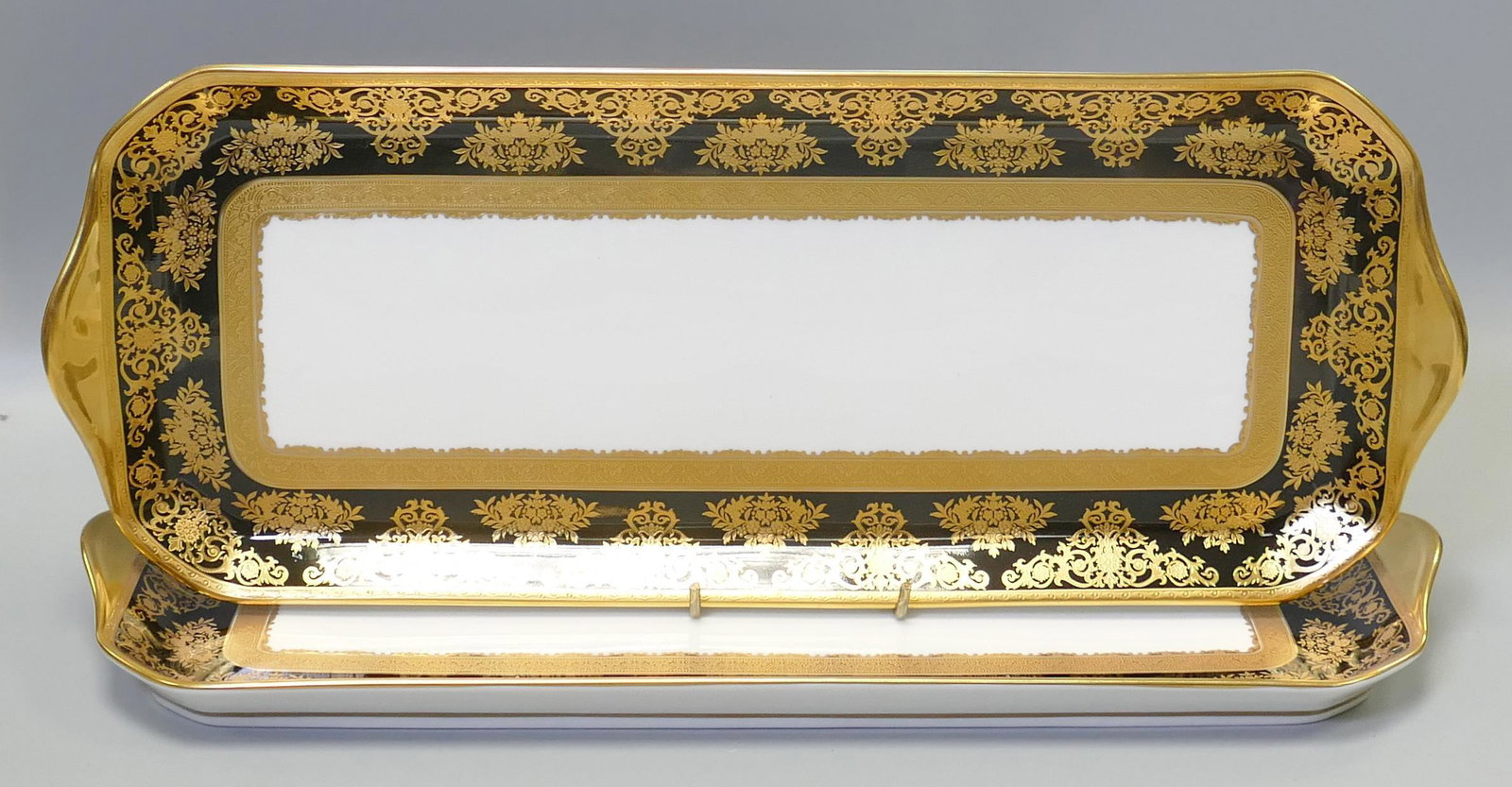 De Lamerie Fine Bone China heavily gilded Black Exotic Garden patterned large sandwich trays,: De Lamerie Fine Bone China heavily gilded Black Exotic Garden patterned large sandwich trays, specially made high end quality items, made in England, length 39cm. (2)