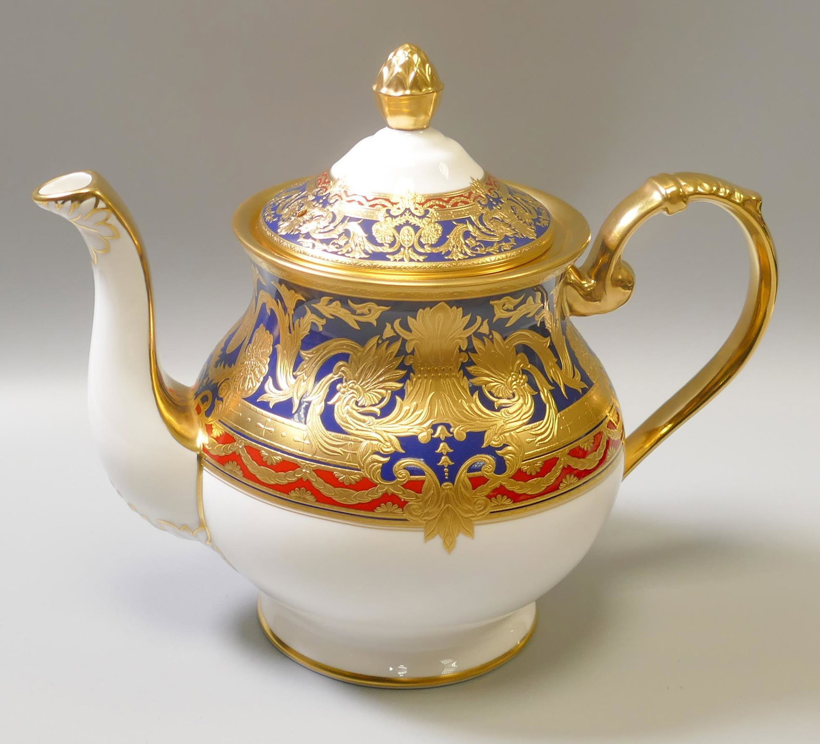 De Lamerie Fine Bone China heavily gilded Dark Blue Empress patterned teapot, specially made high: De Lamerie Fine Bone China heavily gilded Dark Blue Empress patterned teapot, specially made high end quality item, made in England, diameter 20cm.