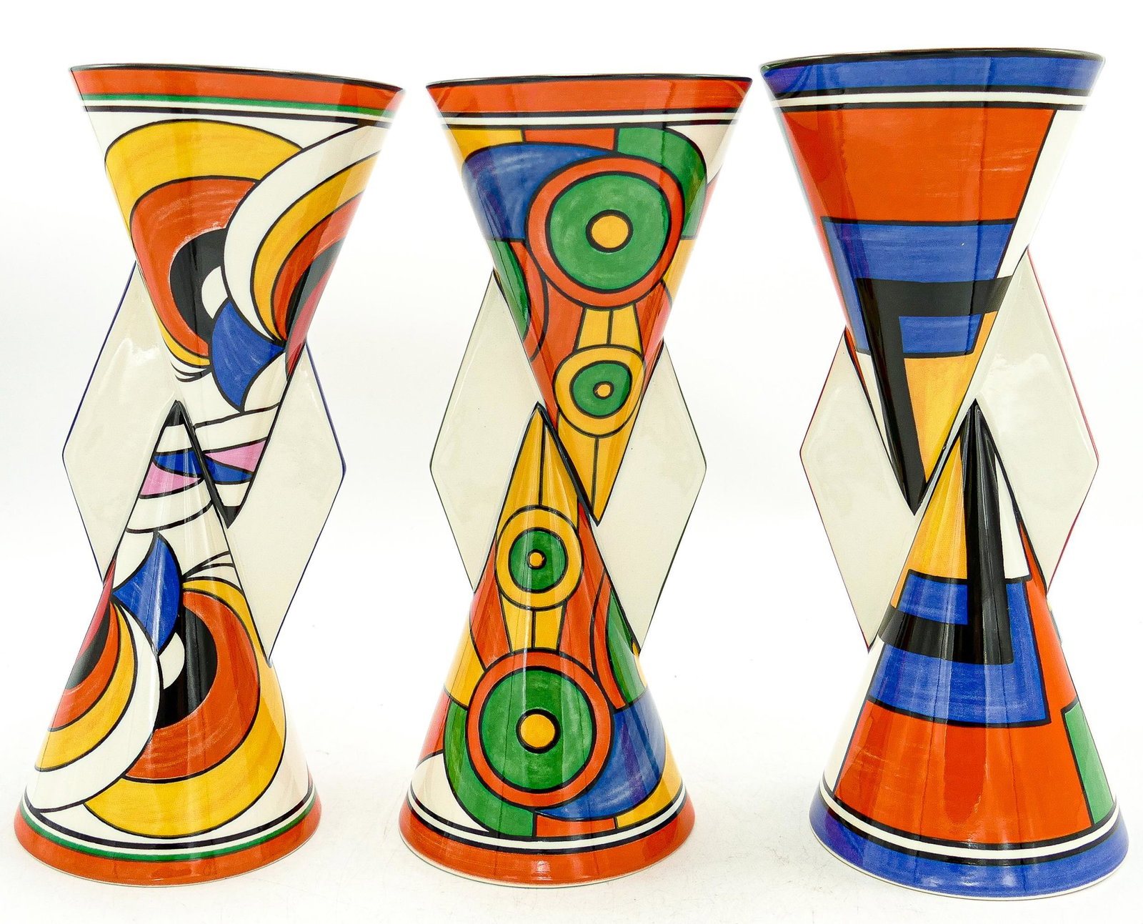 Wedgwood Clarice Cliff patterned limited edition vases in Swirls, Sliced Circle & Mondrian patterns,: Wedgwood Clarice Cliff patterned limited edition vases in Swirls, Sliced Circle & Mondrian patterns, each 23cm, with certificates. (3)