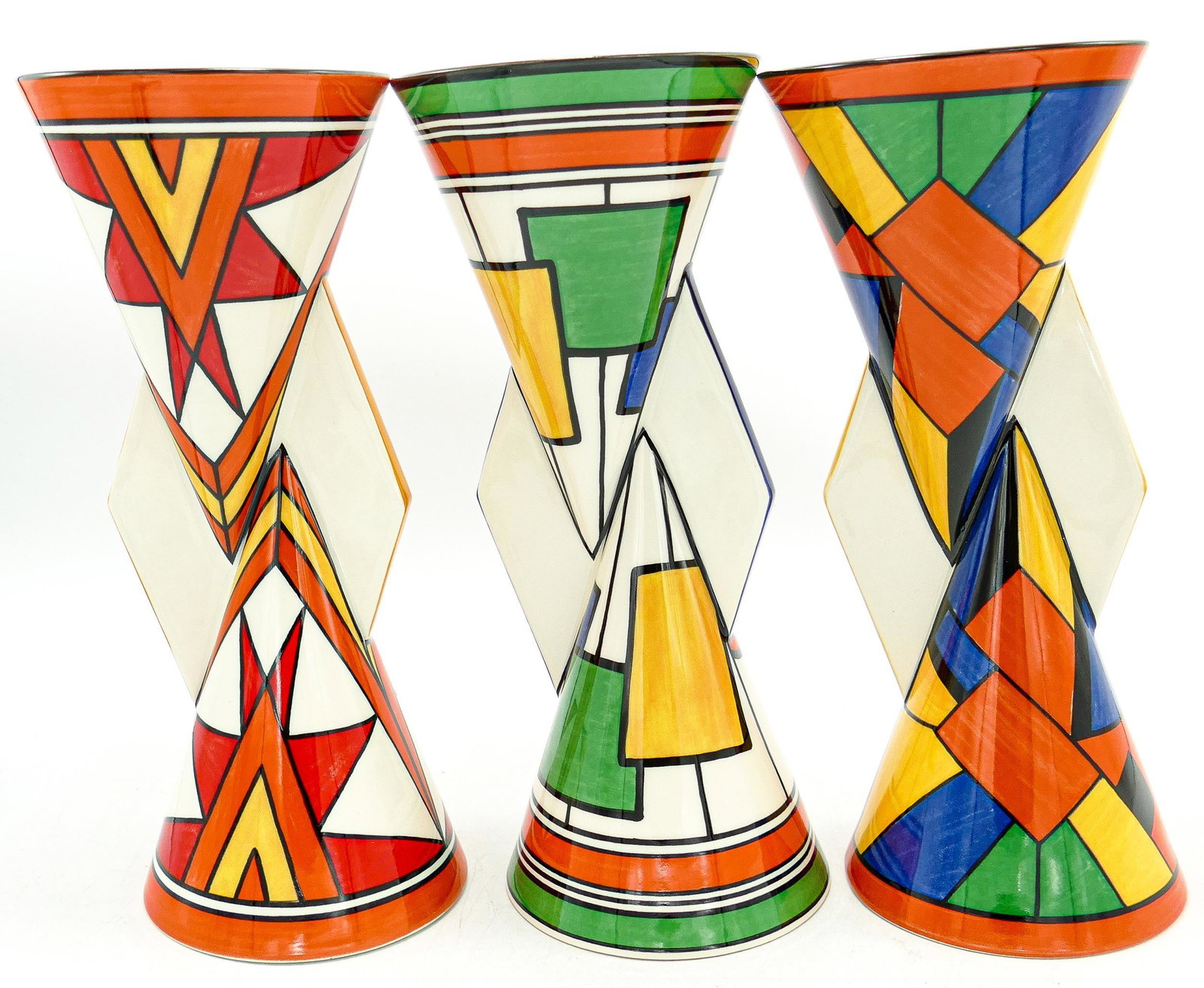 Wedgwood Clarice Cliff patterned limited edition vases in Sunburst, Circles & Squares & Cubist: Wedgwood Clarice Cliff patterned limited edition vases in Sunburst, Circles & Squares & Cubist patterns, each 23cm, with certificates. (3)
