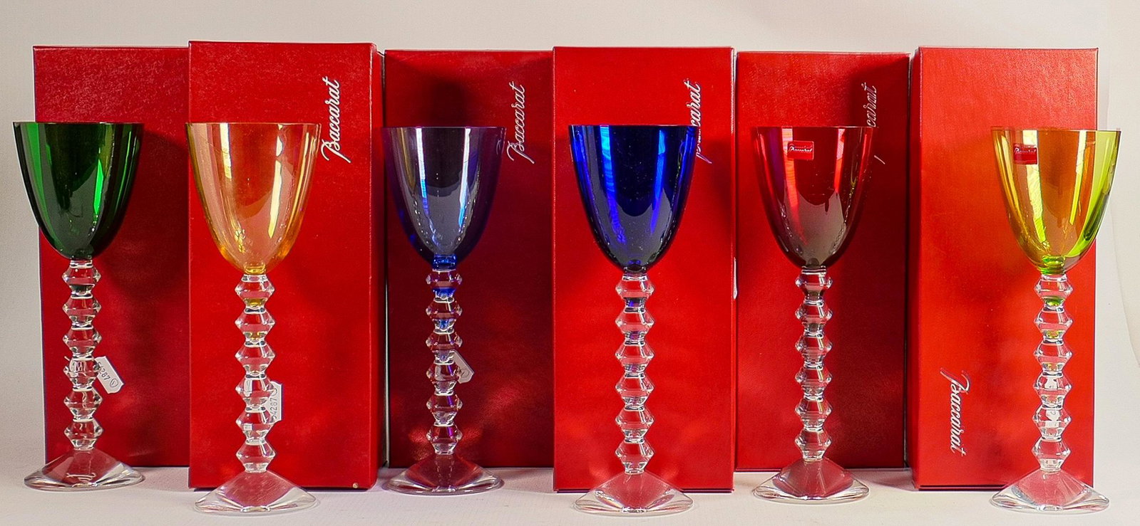 Six Baccarat coloured boxed Rhine wine glasses, colours to include green, blue, yellow and red. (6): Six Baccarat coloured boxed Rhine wine glasses, colours to include green, blue, yellow and red. (6)