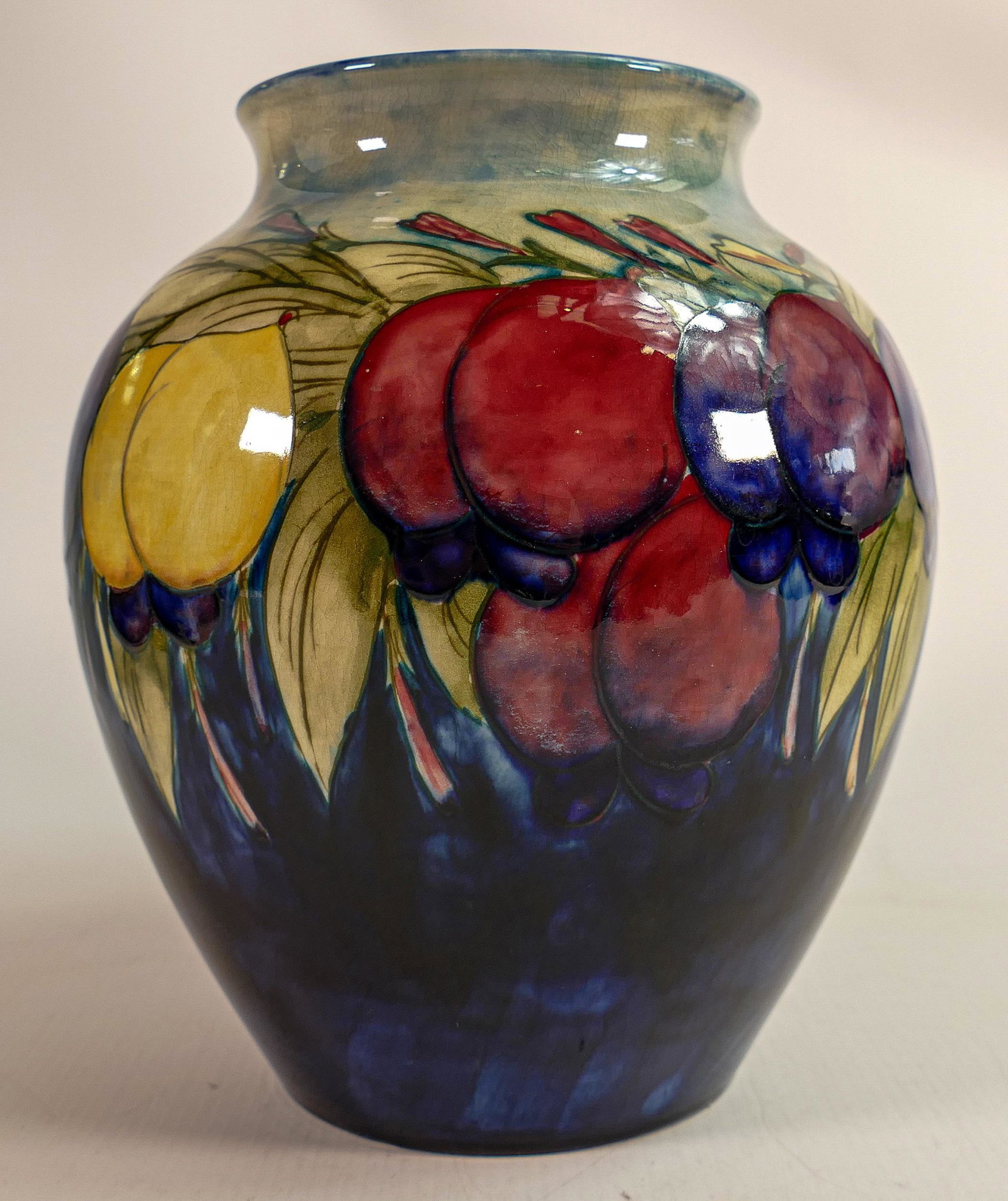 William Moorcroft vase decorated in the Wisteria design, C1930, h.22.5cm.: William Moorcroft vase decorated in the Wisteria design, C1930, h.22.5cm.