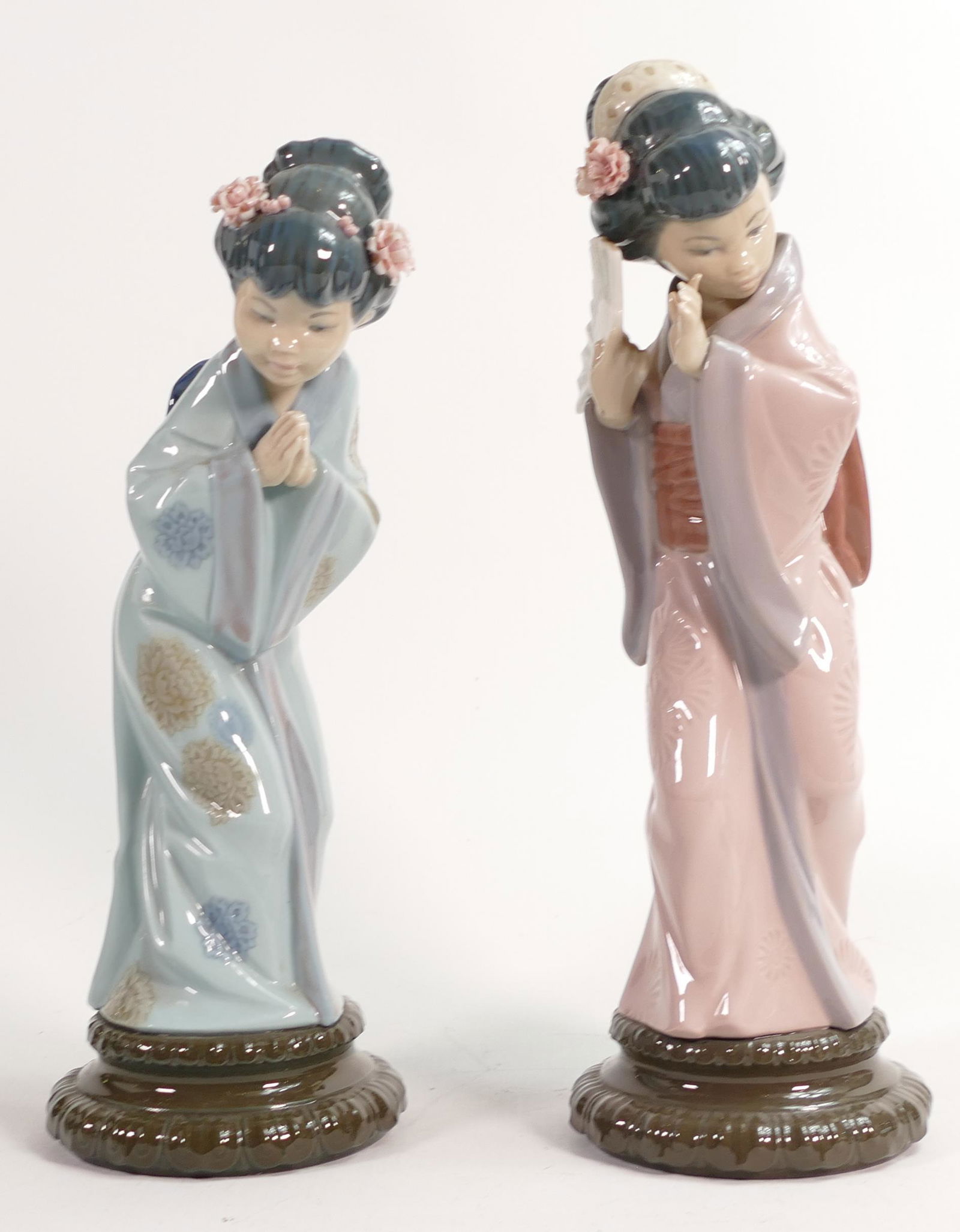 Two Lladro figurines of Geisha Girls. Height of tallest approx 30cm. Slight Damage to one figure on (1 of 4)