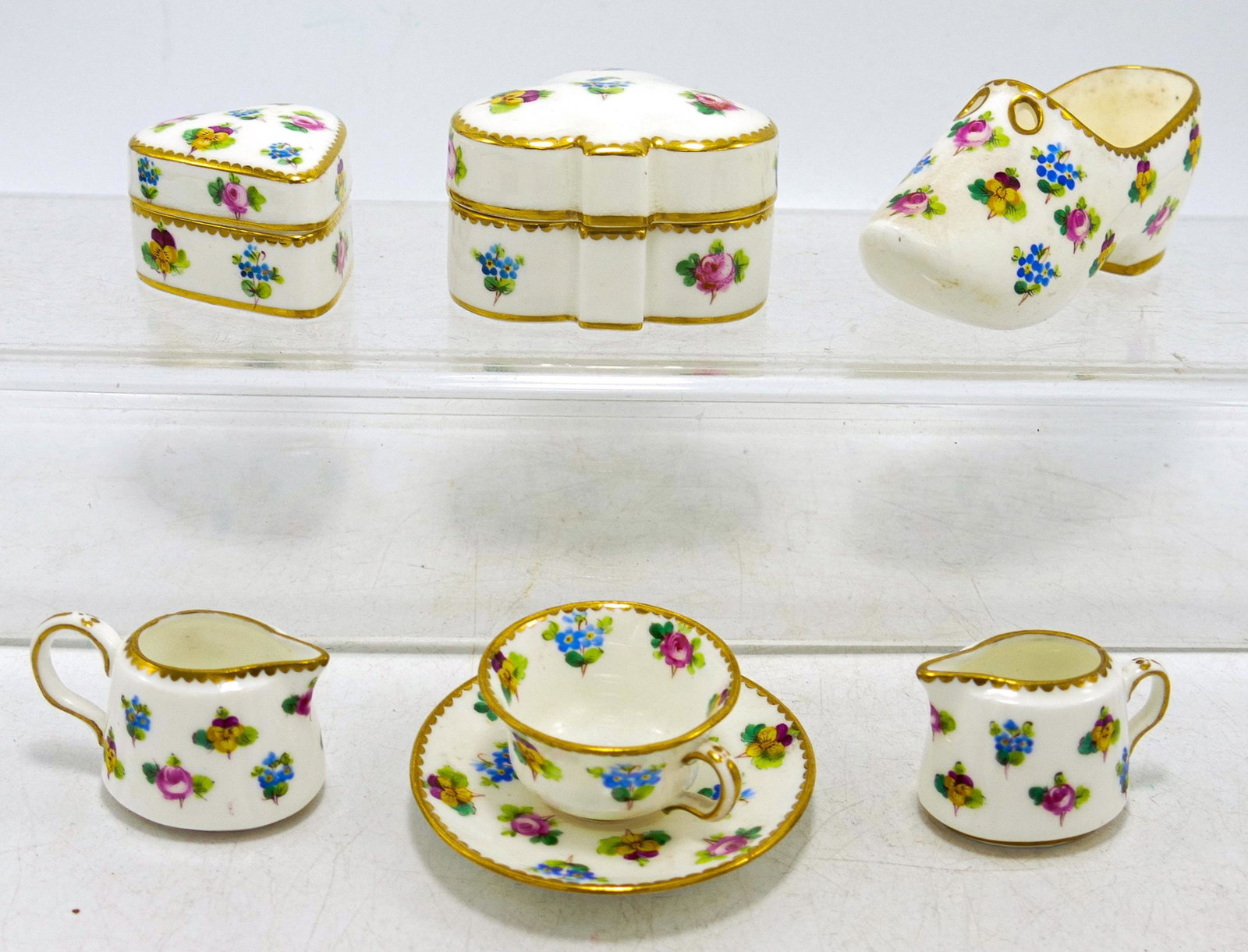 A collection of Mintons hand painted miniature items, decorated with flowers. (6): A collection of Mintons hand painted miniature items, decorated with flowers. (6)