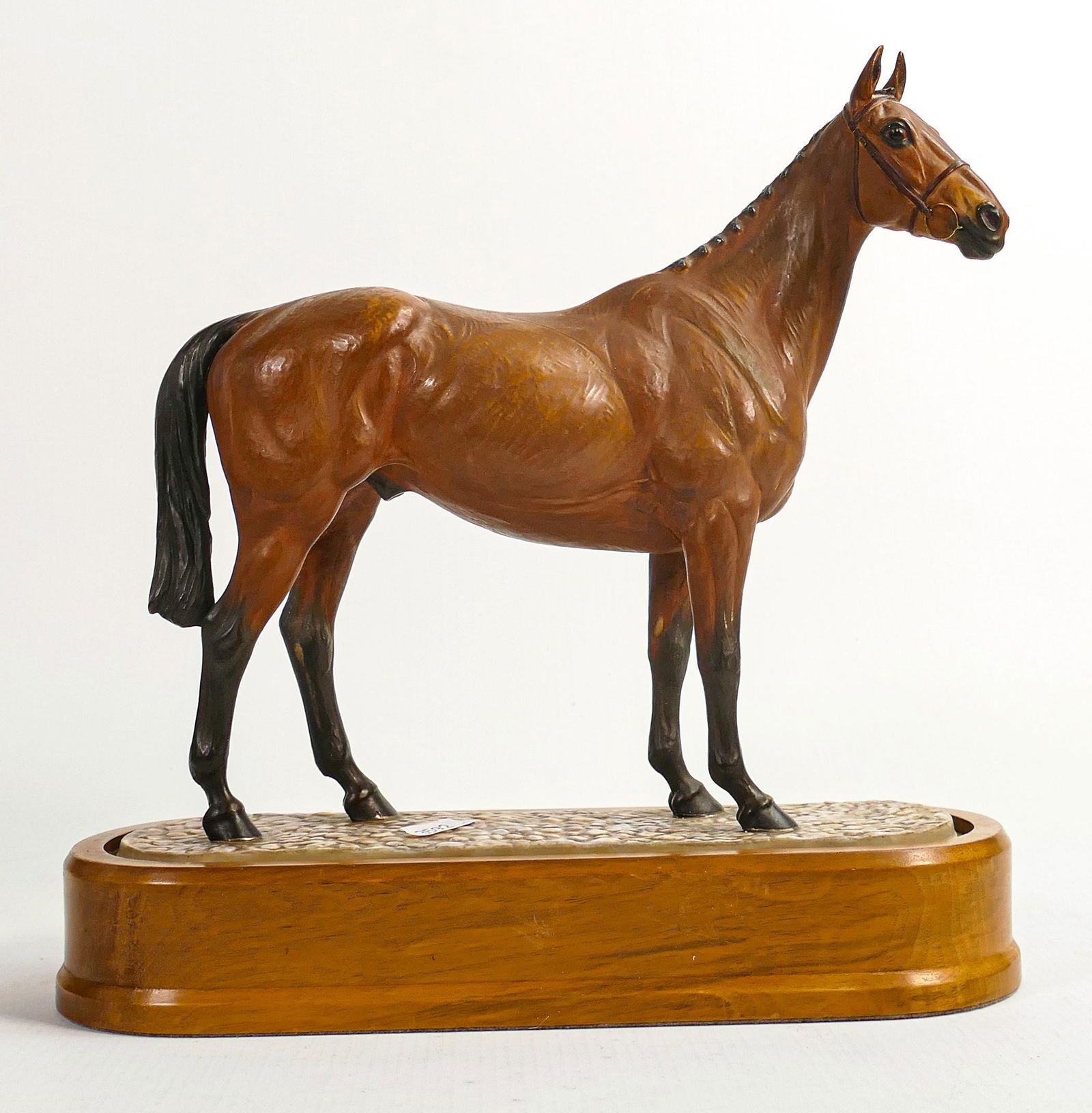 Royal Worcester model of Arkle, owned by Duchess of Westminster, modelled by Doris Lindner 1977 on: Royal Worcester model of Arkle, owned by Duchess of Westminster, modelled by Doris Lindner 1977 on wooden plinth.