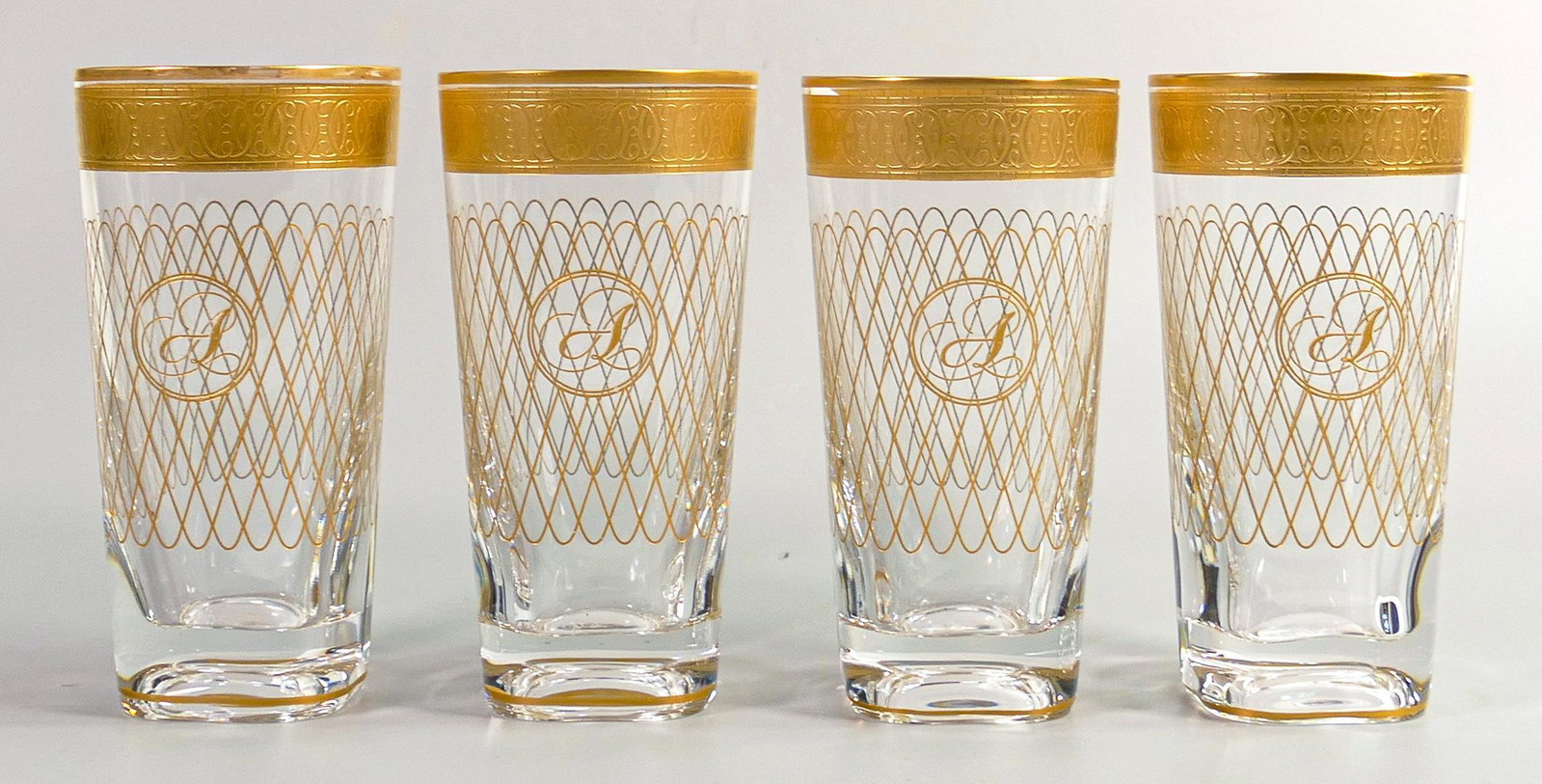 De Lamerie Fine Bone China heavily gilded glass crystal The Twist patterned tumblers with: De Lamerie Fine Bone China heavily gilded glass crystal The Twist patterned tumblers with personalised monogram, specially made high end quality items, made in England, height 14cm (4)