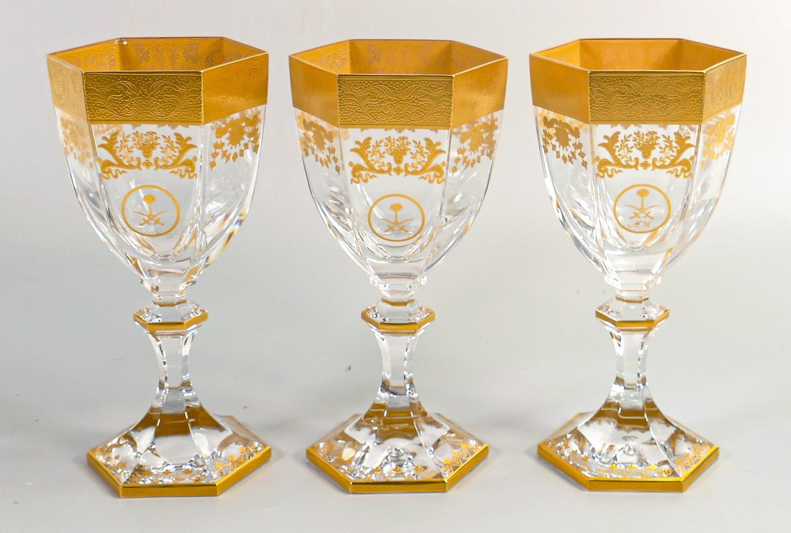 De Lamerie Fine Bone China Versailles patterned heavily gilded wine glasses with Bahrain motif,: De Lamerie Fine Bone China Versailles patterned heavily gilded wine glasses with Bahrain motif, specially made high end quality items, made in England, height 17.5cm (3)