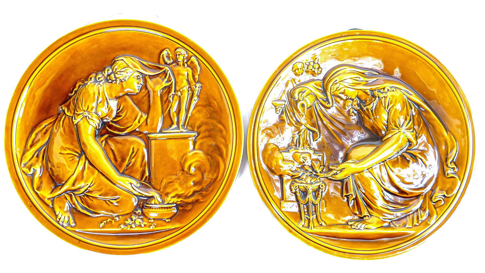 Pair of 19th century Wedgwood round plaques, embossed decoration of classical scenes in majolica (1 of 1)
