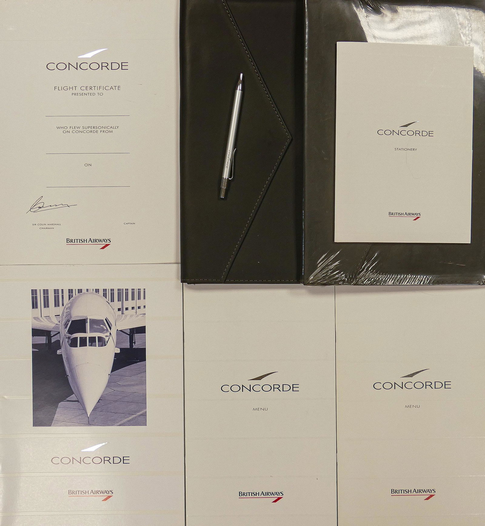 Two Vintage Concorde gift packs with contents including - pens, menus, stationary, luggage tags, one: Two Vintage Concorde gift packs with contents including - pens, menus, stationary, luggage tags, one pack sealed. (2)