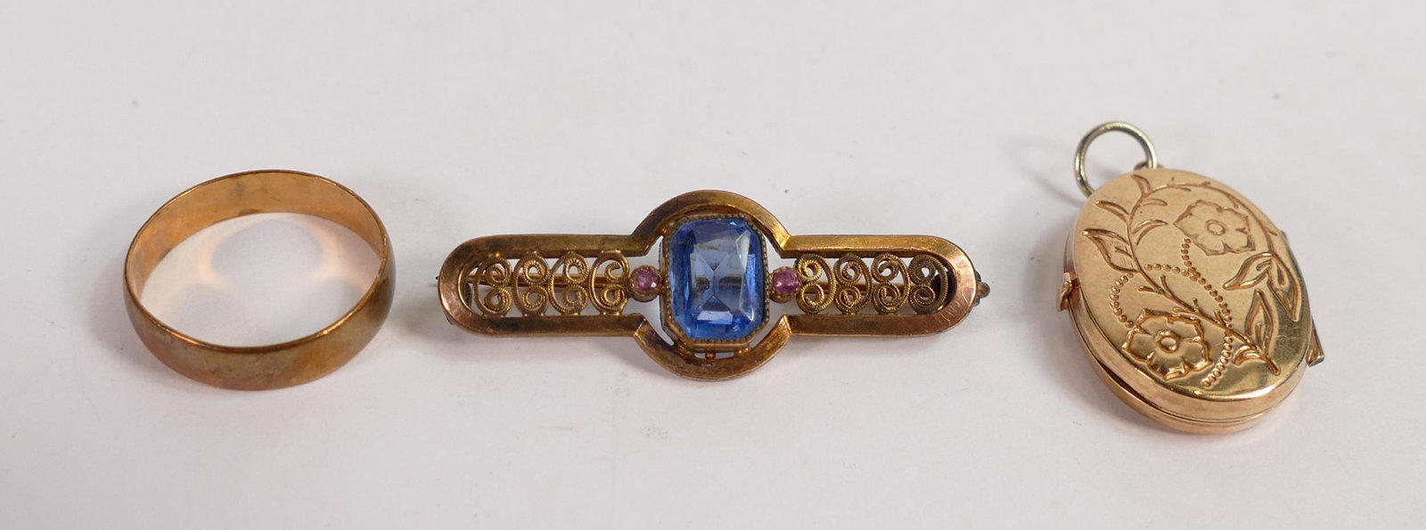 9ct hallmarked gold wedding band / ring, together with un-hallmarked gold locket (tested as 9ct),: 9ct hallmarked gold wedding band / ring, together with un-hallmarked gold locket (tested as 9ct), weighing together 4g, plus a non gold brooch.