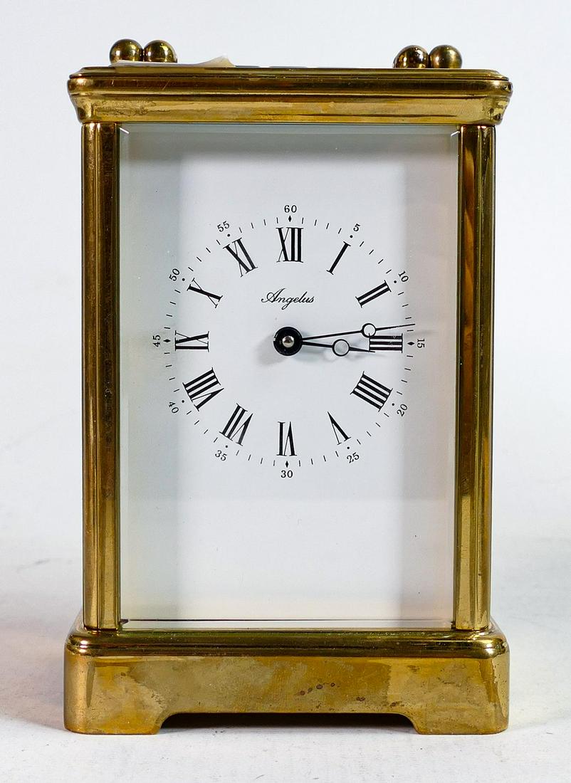 A 20th century Angelus brass cased carriage clock, the white dial with Roman numerals in black, (1 of 5)