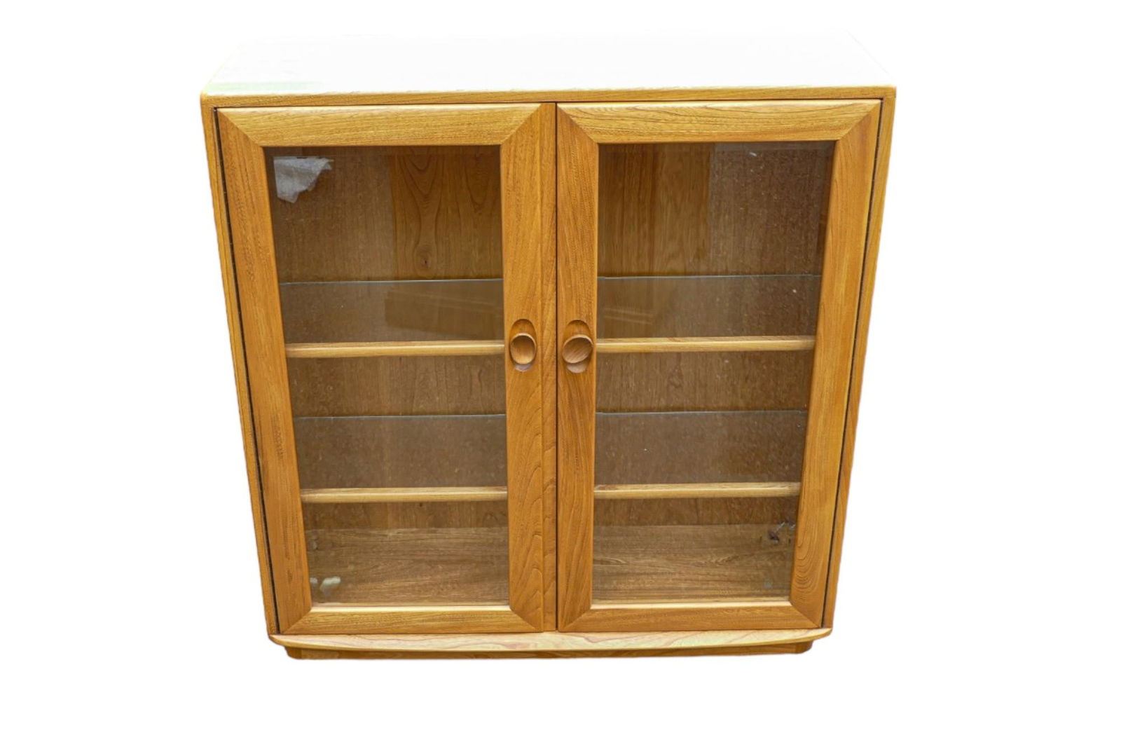 Late 20th century Light Ercol glazed display cabinet/bookcase, height 98cm, length 91cm & depth 31cm: Late 20th century Light Ercol glazed display cabinet/bookcase, height 98cm, length 91cm & depth 31cm