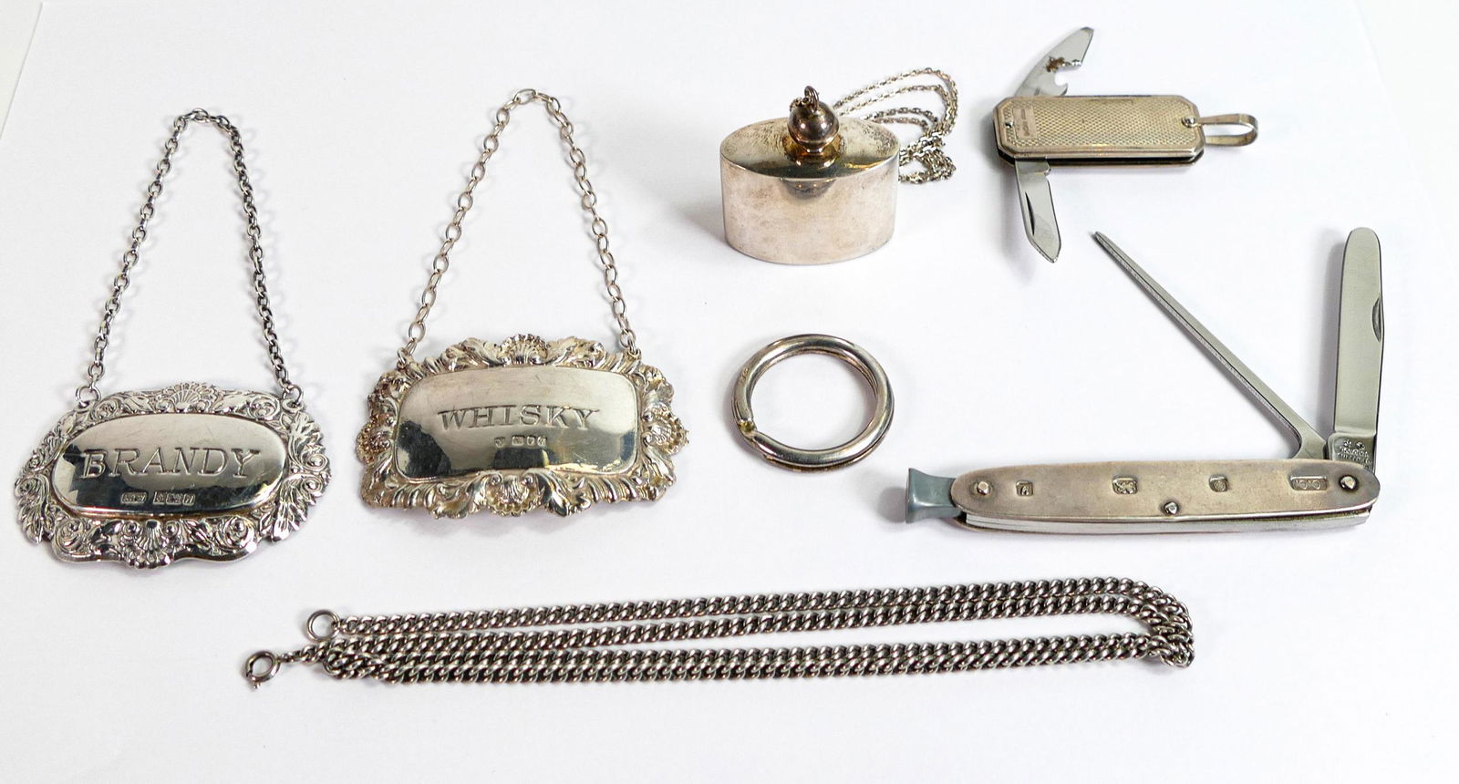 Small group of sterling silver items including pen knife, pipe knife, 2 x spirit labels, long silver (1 of 2)
