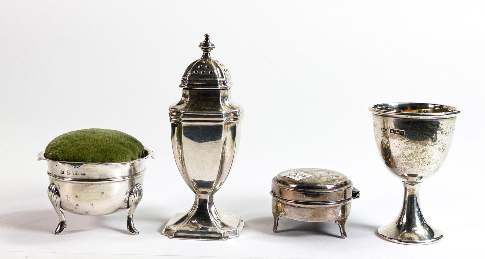 Sterling silver Mustard pot & egg cup, weight 127.2g, together with small silver box B'ham 1919 by: Sterling silver Mustard pot & egg cup, weight 127.2g, together with small silver box B'ham 1919 by Napper & Davenport and a silver pin cushion, both loaded (4)
