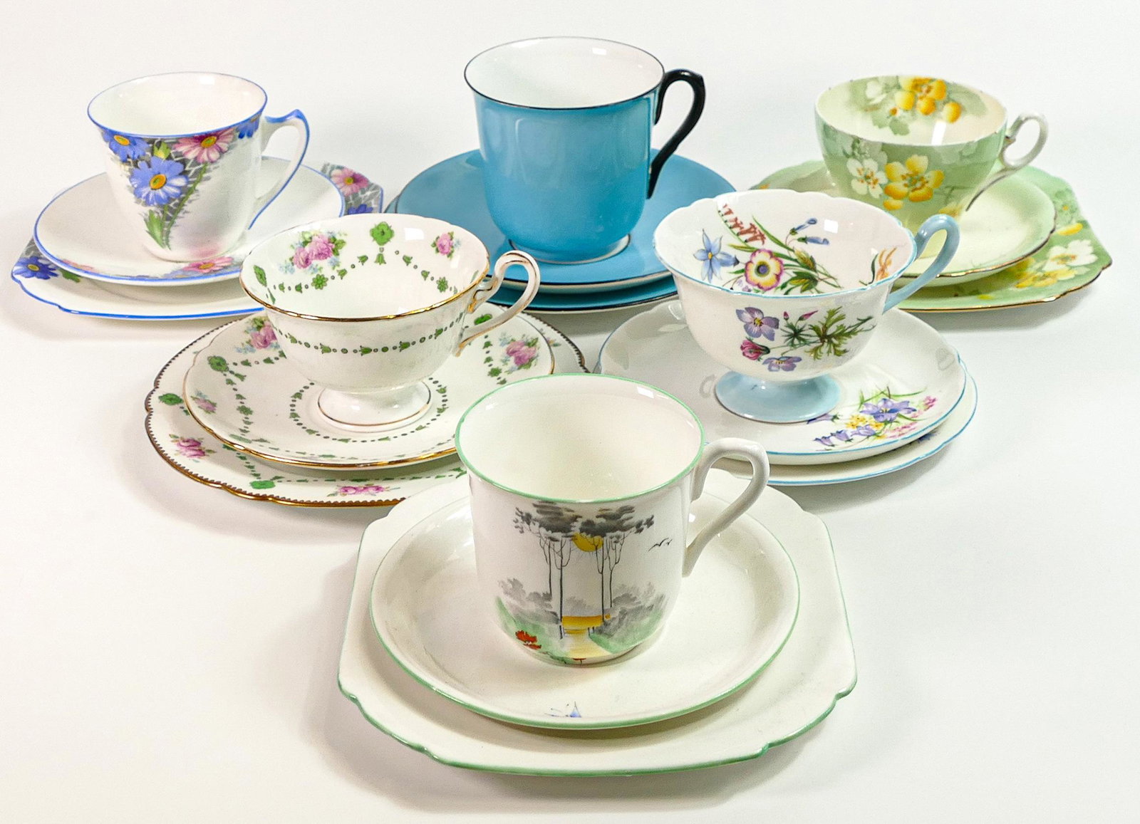 Six Shelley trios in various cup shapes to include Gainsborough 13668, Vincent 2110, Gainsborough: Six Shelley trios in various cup shapes to include Gainsborough 13668, Vincent 2110, Gainsborough 8298, Cambridge 13041, Stand 12116 and Vincent breakfast size 11049/25 (18 pieces)