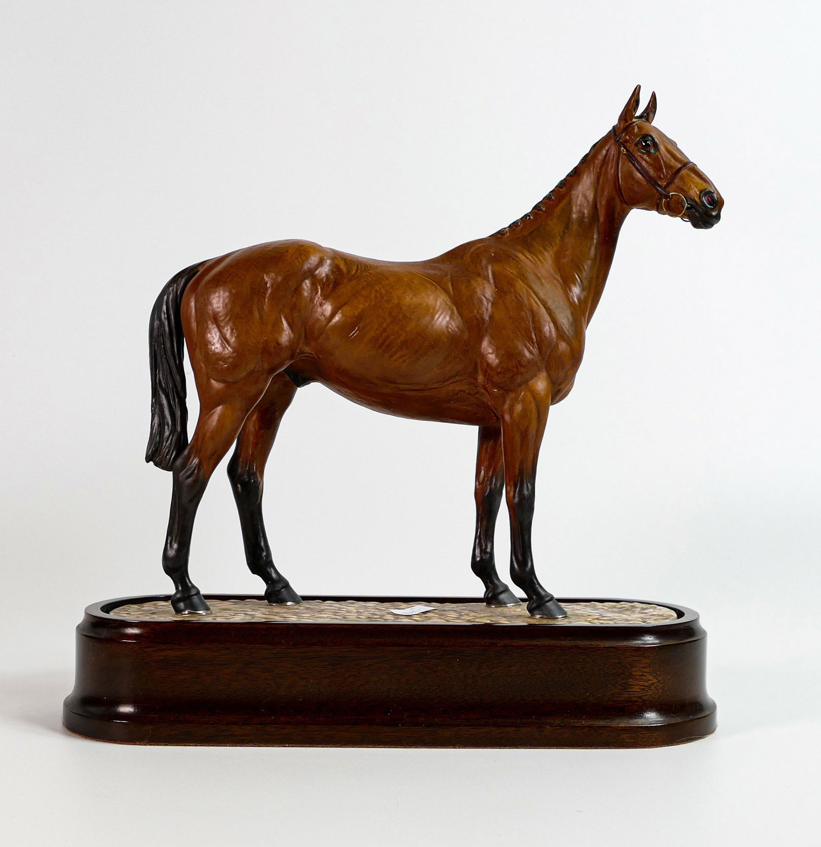 Royal Worcester model of Arkle, owned by Anne, Duchess of Westminster, modelled by Doris Lindner on: Royal Worcester model of Arkle, owned by Anne, Duchess of Westminster, modelled by Doris Lindner on ceramic and wooden plinth with certificate.