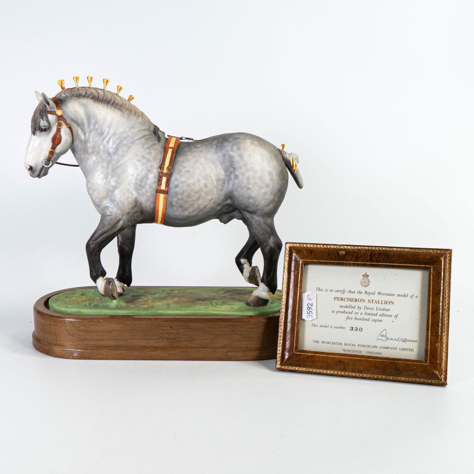Royal Worcester model of a Percheron stallion modelled by Doris Lindner, limited edition with wooden: Royal Worcester model of a Percheron stallion modelled by Doris Lindner, limited edition with wooden plinth and leather framed certificate.