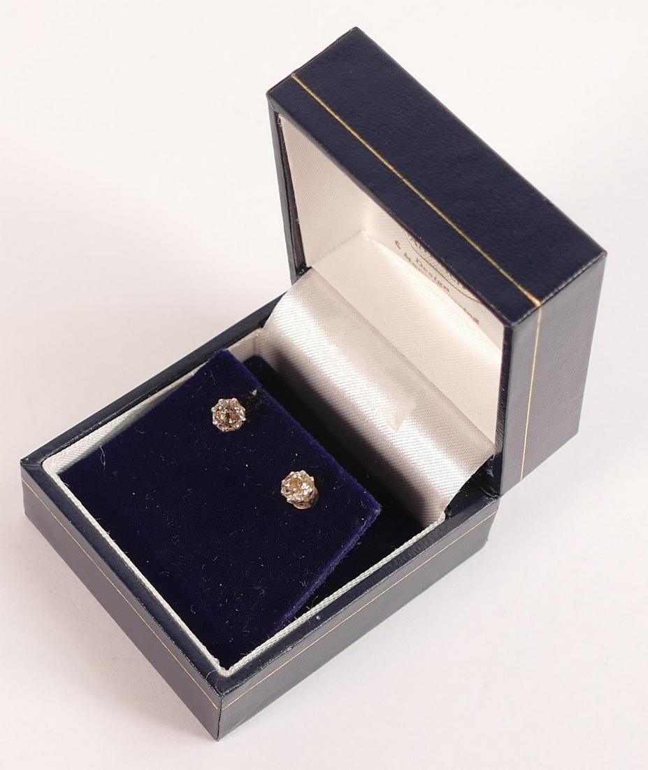 Gold mounted old cut diamond earrings, with inclusions showing under eyeglass.  Stones measure a (1 of 1)