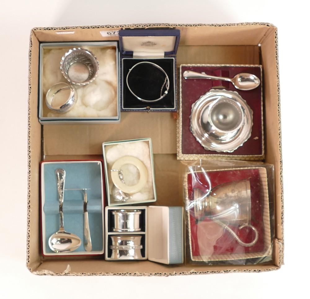 A collection of silver and silver plated items to include silver napkin rings, bangle, bowl together: A collection of silver and silver plated items to include silver napkin rings, bangle, bowl together with plated egg cup and spoon, tankard etc. Silver weight 105 grams