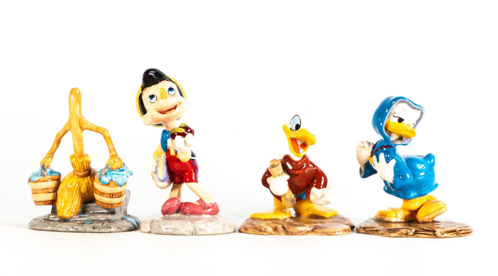 Royal Doulton Disney Showcase Collection of Buckets of Mischief, Noah's Helpter, Oinocchio and Heart: Royal Doulton Disney Showcase Collection of Buckets of Mischief, Noah's Helpter, Oinocchio and Heart on a String Figures, Boxed. (4)