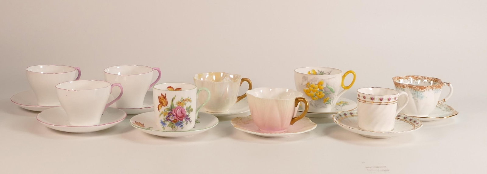 Shelley coffee cups & saucers to include Dainty shape x 3, New Cambridge x 3, Oxford, Savoy and: Shelley coffee cups & saucers to include Dainty shape x 3, New Cambridge x 3, Oxford, Savoy and Spiral ( 18 pieces)