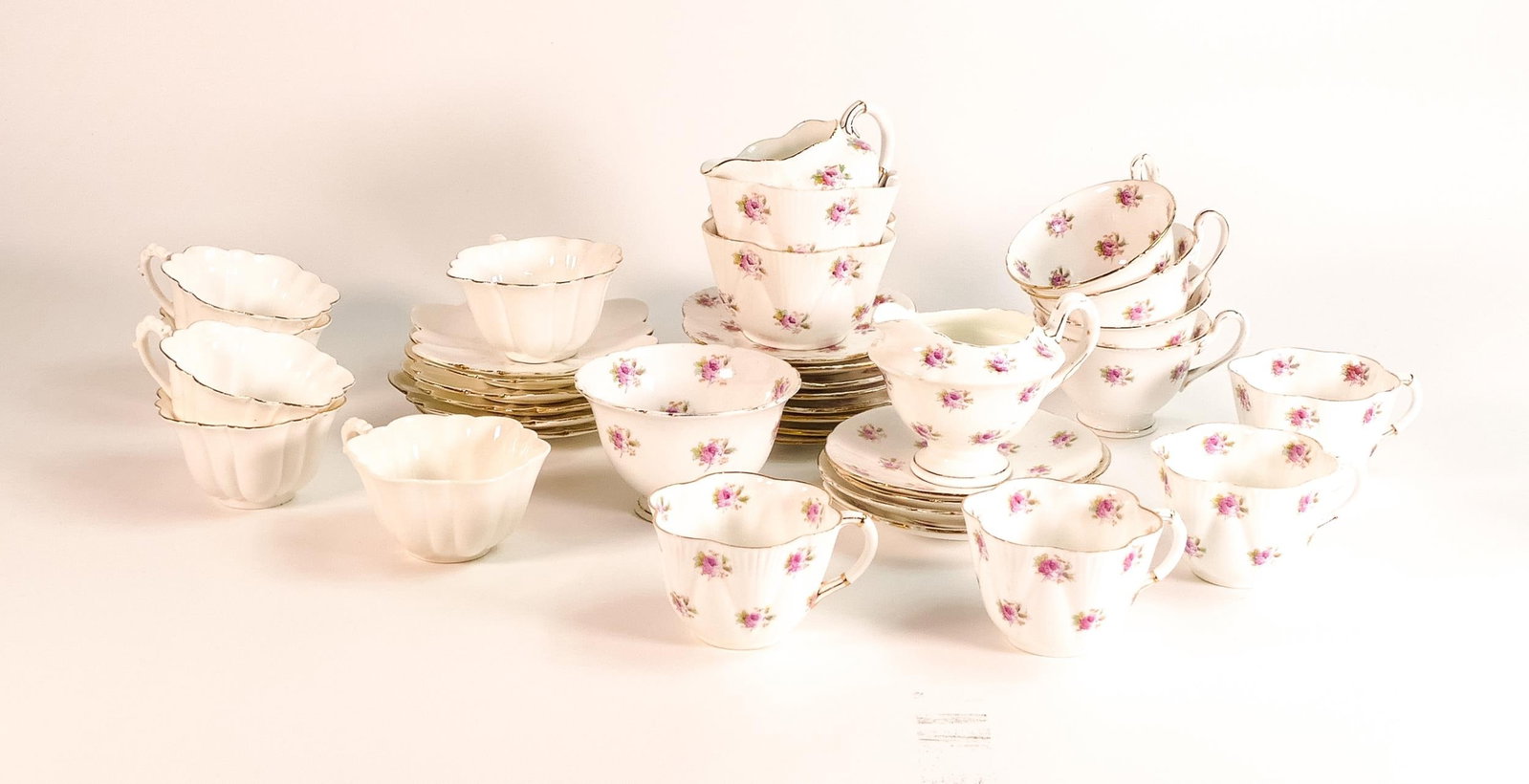 A collection of Wileman & Co pattern 7447 to include 4 coffee cups and saucers, Gainsborough cream: A collection of Wileman & Co pattern 7447 to include 4 coffee cups and saucers, Gainsborough cream jug and sugar bowl, 6 coffee & saucers in the empire shape etc ( 37 pieces)