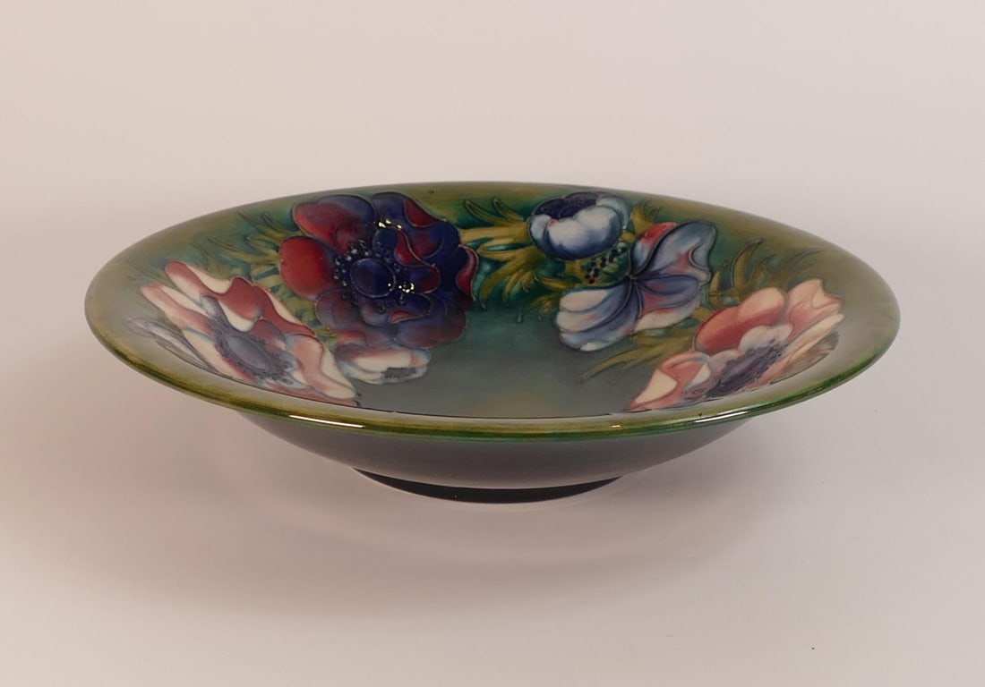 Moorcroft Anemone fotted bowl on green back ground. Diameter 25cm (1 of 2)