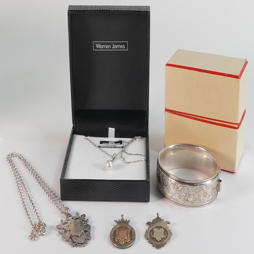 Cased large silver hallmarked bangle (slight dent), Silver chain & freshwater cultured pearl silver: Cased large silver hallmarked bangle (slight dent), Silver chain & freshwater cultured pearl silver mounted pendant cased, and three hallmarked silver watch chain fobs, one with silver chain (58g weig