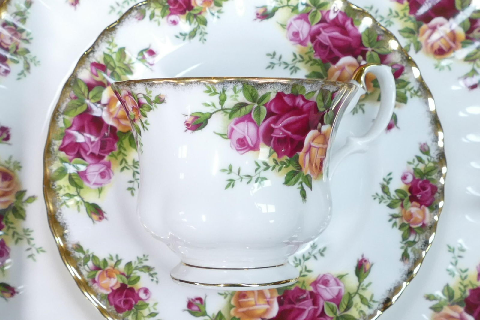 A large collection of Royal Albert Old Country Roses pattern items to include - tea pot, coffee pot,: A large collection of Royal Albert Old Country Roses pattern items to include - tea pot, coffee pot, trios, dinner plates, cake plate, cutlery, milk & sugar, place mats & napkins etc. Some seconds and
