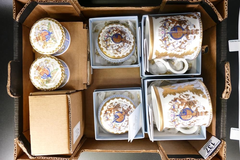 Two Buckingham Palace bone china boxed tankards together with matching trinklet boxes and two Royal: Two Buckingham Palace bone china boxed tankards together with matching trinklet boxes and two Royal Mint Diamond jubilee pill boxes. All boxed