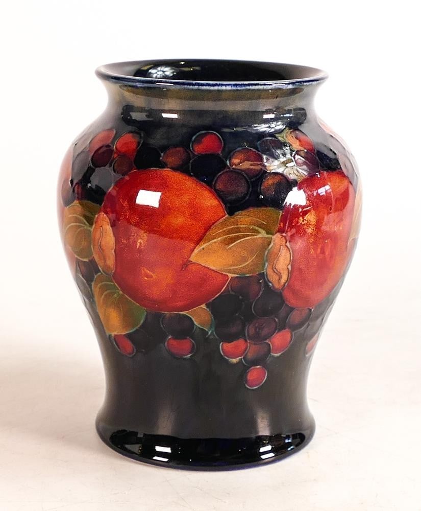 William Moorcroft Pomegranate pattern on blue ground Baluster vase. Height: 14.3cm (1 of 3)