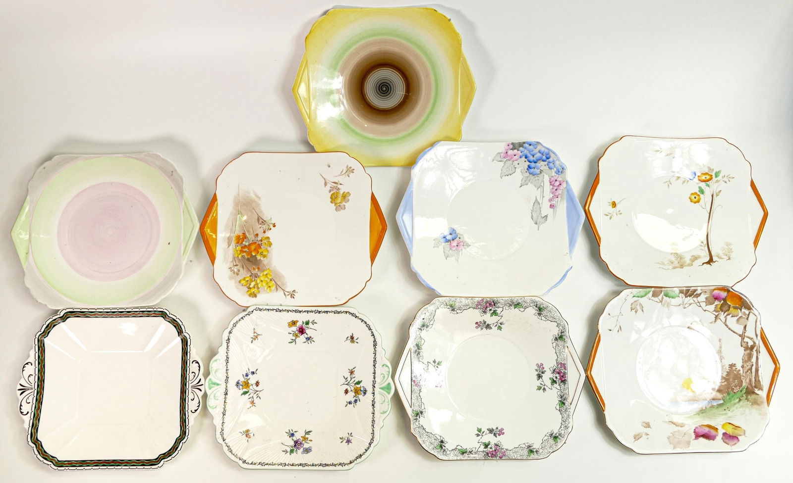 Nine Shelley tab handle square bread and butter plates. Patterns 11216, 2129, 293, 0168, 0183, 070, (1 of 1)