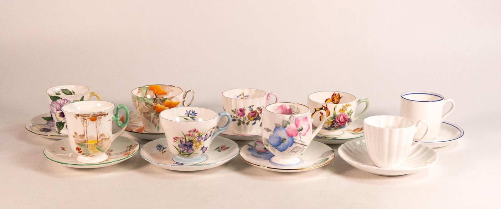 Nine Shelley coffee cups and saucers to include patterns - Ludlow 2367, 097, plain white, Dainty: Nine Shelley coffee cups and saucers to include patterns - Ludlow 2367, 097, plain white, Dainty 13823, Cambridge 0151, Court 2234, Kent floral, Henley 13668 and Carlton 167 (18 pieces) some issues no
