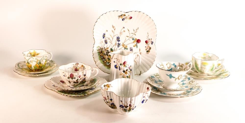 Wileman trios x 3 consisting of Dainty shape pattern 7443, Violet shape pattern 9651, Gainsborough: Wileman trios x 3 consisting of Dainty shape pattern 7443, Violet shape pattern 9651, Gainsborough shape pattern 7367 together with Alexandra trio, bread & butter plate, milk jug and sugar bowl (15 pi