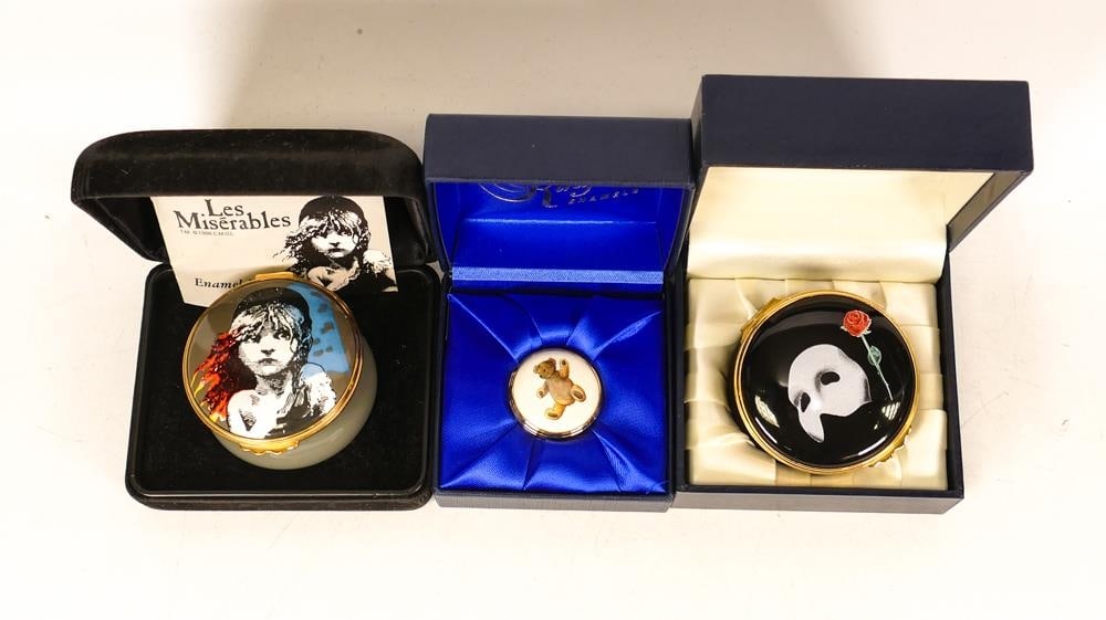 Three Kingsley enamelled boxes to include Phantom of the Opera, Les Misiables and teddy. All: Three Kingsley enamelled boxes to include Phantom of the Opera, Les Misiables and teddy. All boxed (3)