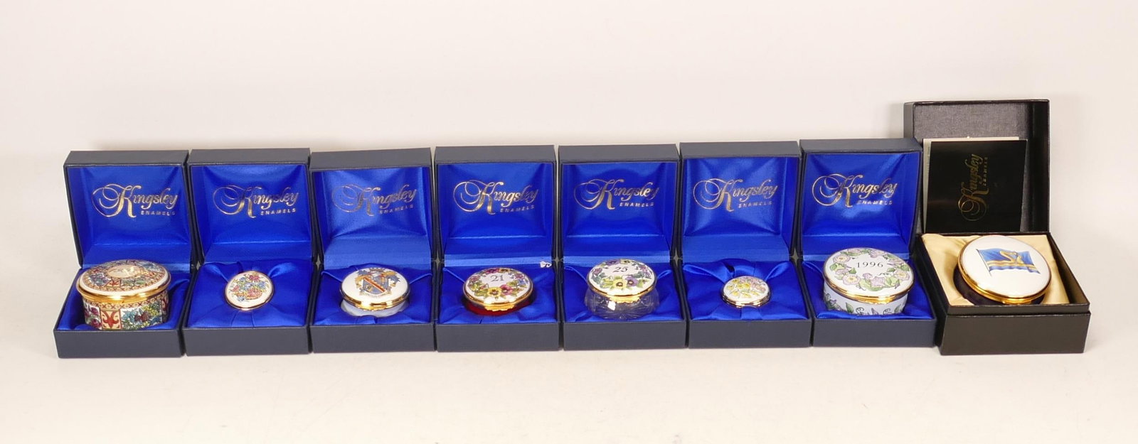 Eight Kingsley enamelled boxes to include Stena sealine, Buttercups & daisies, 1997, 25th: Eight Kingsley enamelled boxes to include Stena sealine, Buttercups & daisies, 1997, 25th Anniversary, 1994, Amagh council, 21st celebrations and floral. All boxed (8)