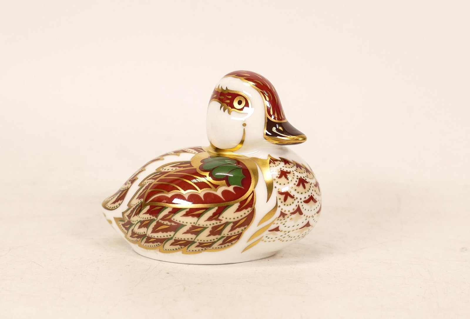 Royal Crown Derby porcelain Bakewell Duckling, gold button and printed marks in red, boxed.: Royal Crown Derby porcelain Bakewell Duckling, gold button and printed marks in red, boxed.